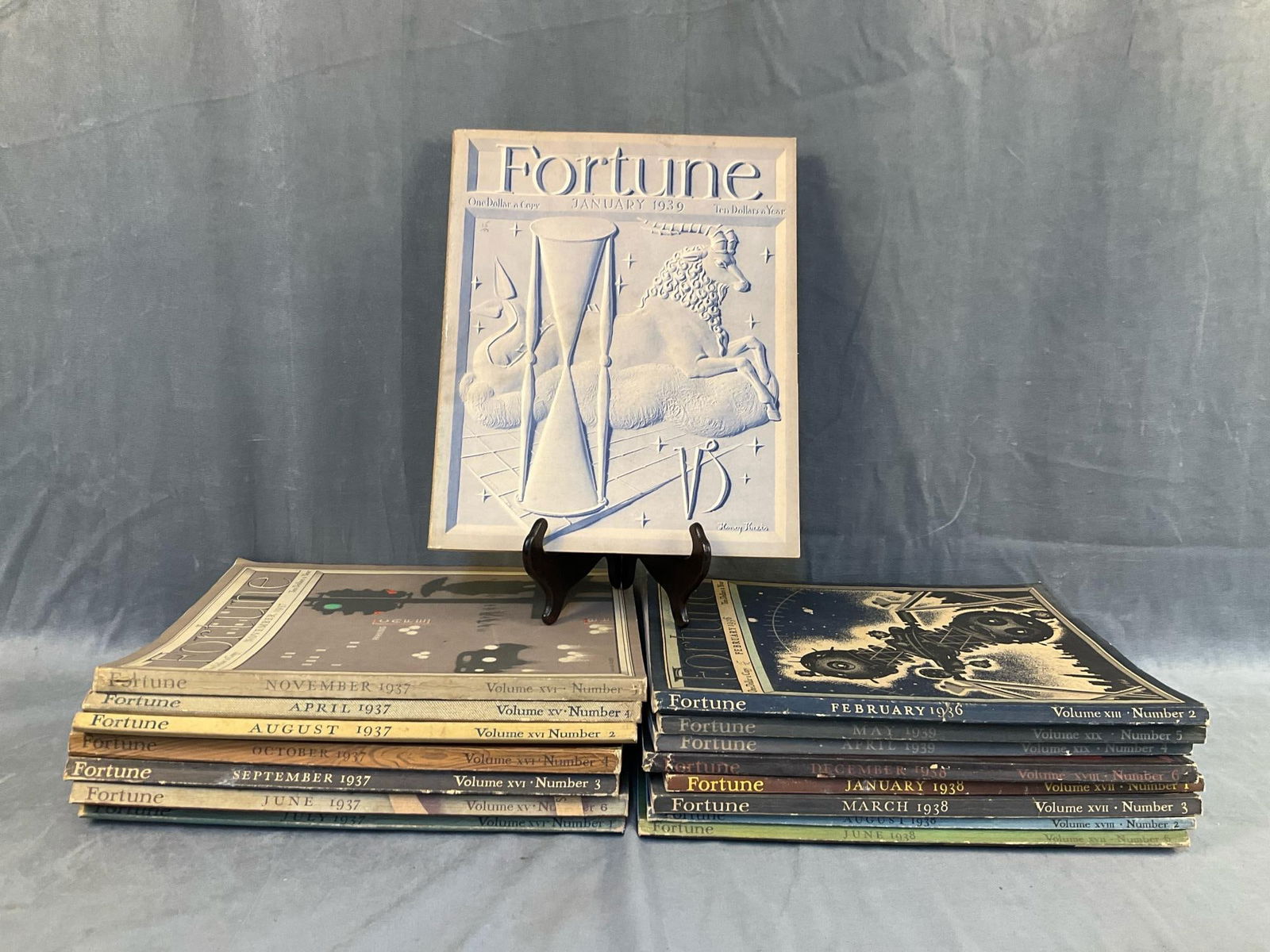 Fortune Magazine: Lot of sixteen vintage Fortune Magazines from the 1930's. One 1936 issue, seven 1937 issues, five 1938 issues, and three 1939 issues. Some wear, spines faded, otherwise good condition. Measures