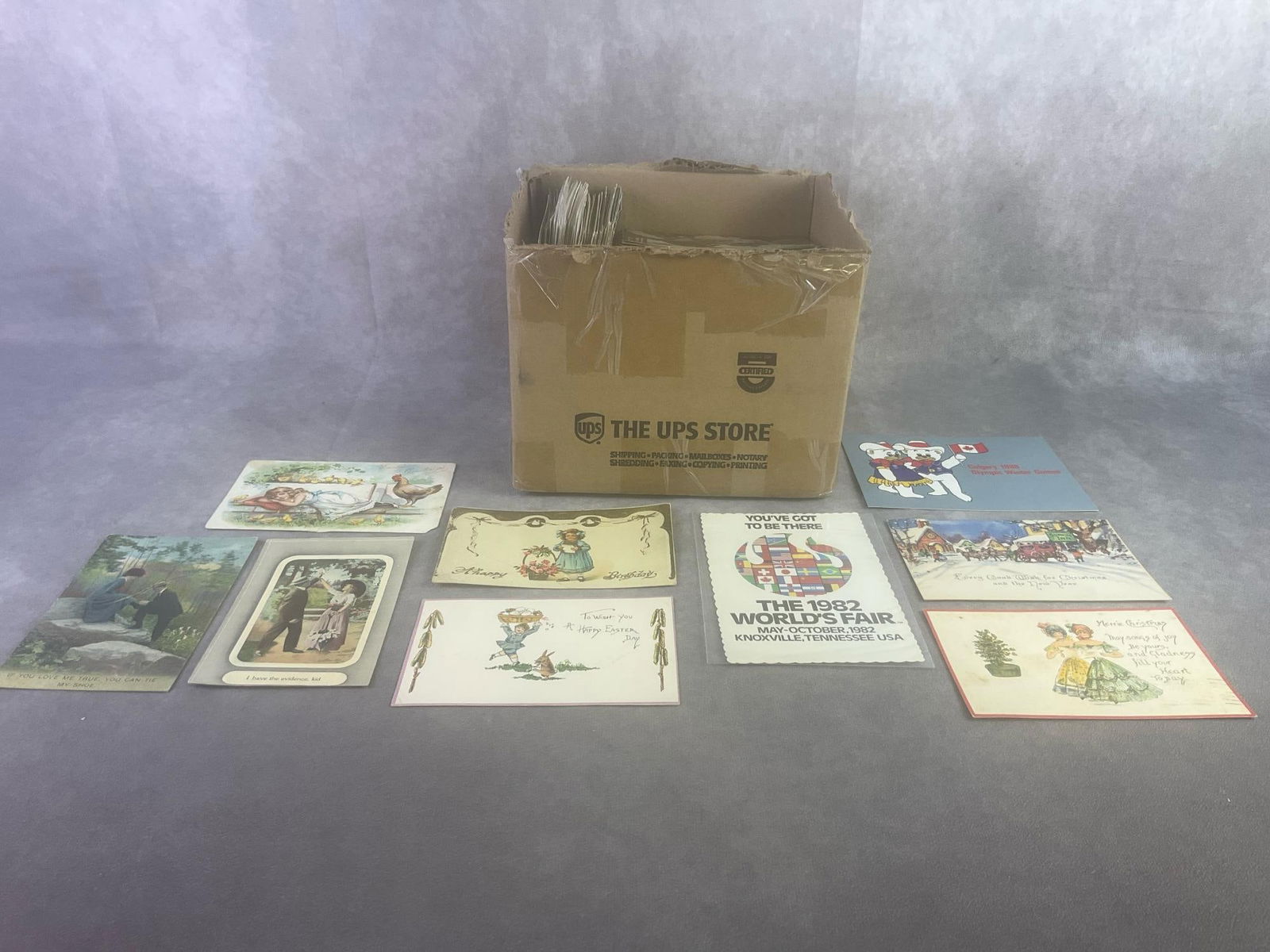 Approximately 500 Postcards: Includes Holiday, Greeting, tourist views, and more. Circulated and non, fair to good condition. Box measures 8.25 inches wide x 8 inches x 6.75 inches tall.