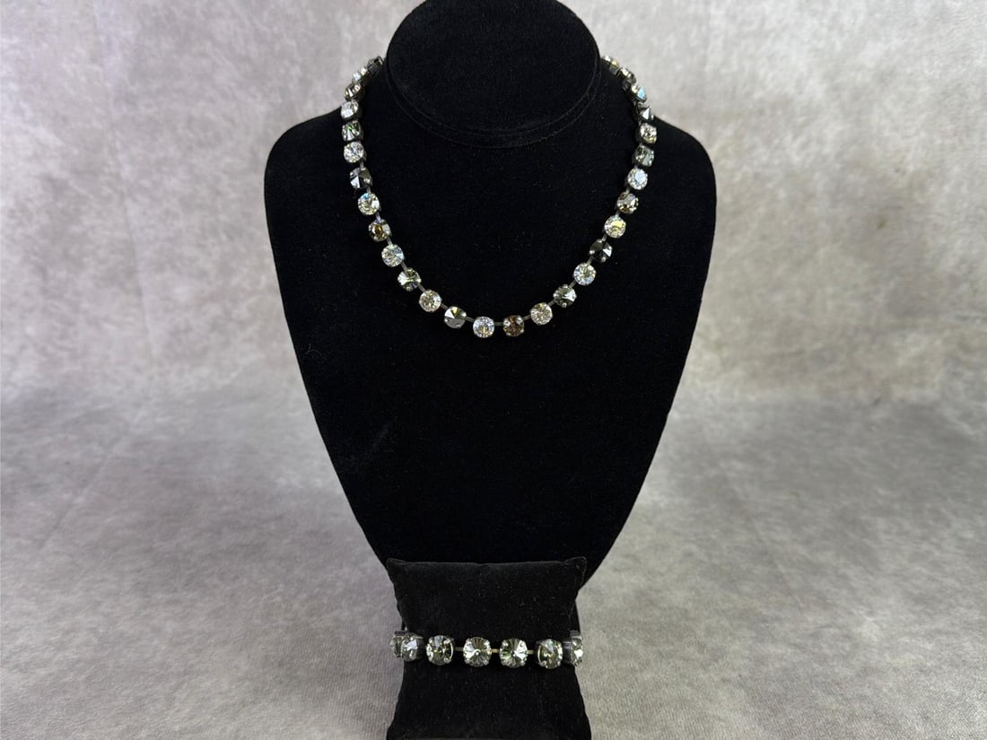 Sabika: Sabika necklace and bracelet featuring a single row of circular cut Swarovski stones in various colors. In good condition and handmade in Austria and Germany. Necklace measures 16 inches.