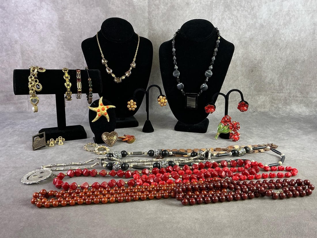Costume Jewelry: Lot of costume jewelry including seven brooches, two earrings, four bracelets, and ten necklaces. Brands including Sarah Coventry, Avon, Monet, and more. All in good condition. Longest necklace
