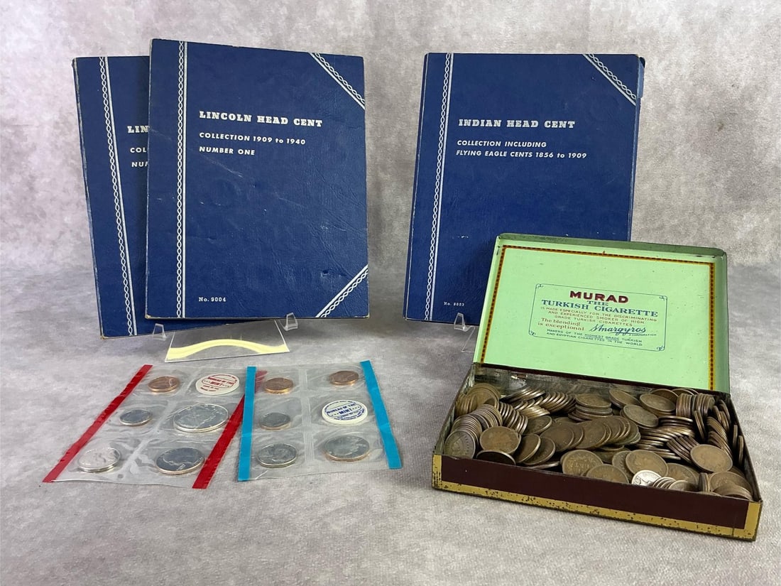 Proof Sets & Pennies: Two 1970 proof sets, three penny books and tin full of Indian head pennies. All in good condition. Each book measures 5.75 inches wide x 7.5 inches tall.