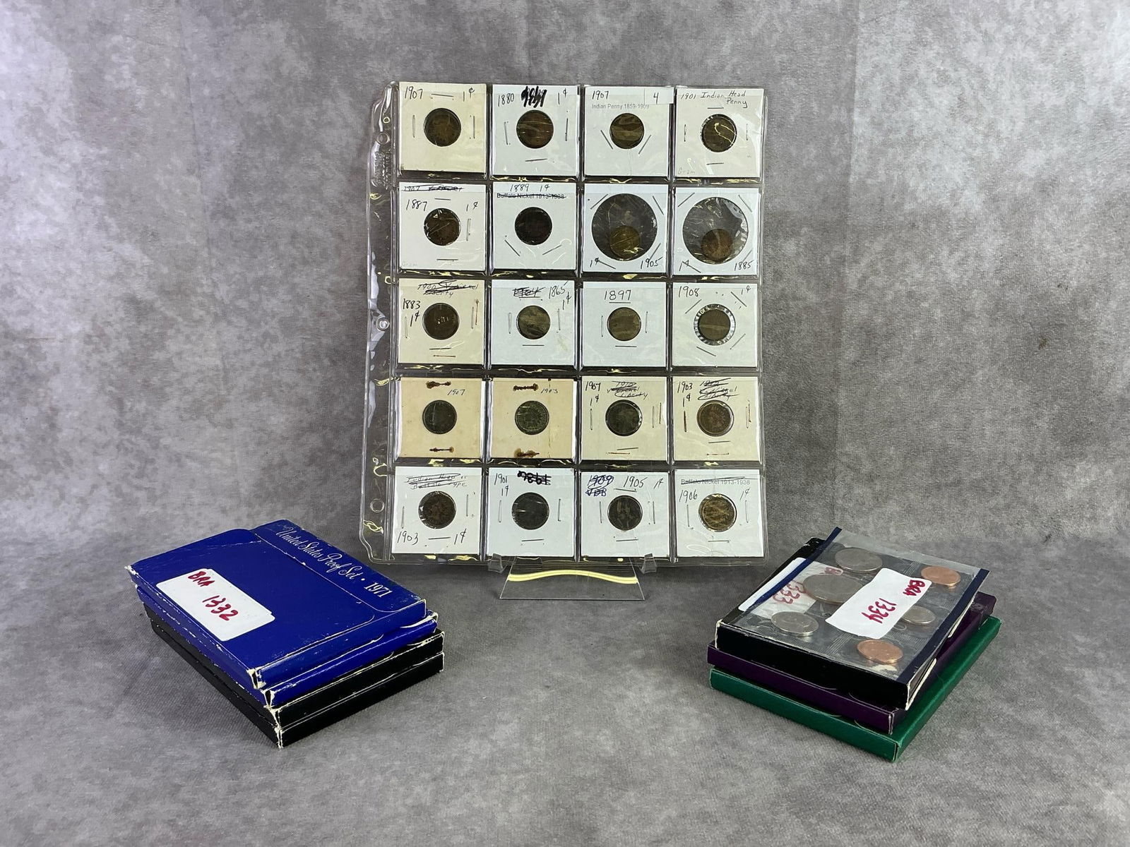 Proof Sets & Indian Head Pennies: Eight United States Proof sets ranging from 1971 to 1994 and sleeve of Indian head Pennie's from, the early 1900s. All in good condition. Sleeve measures 8 inches wide x 11 inches tall.