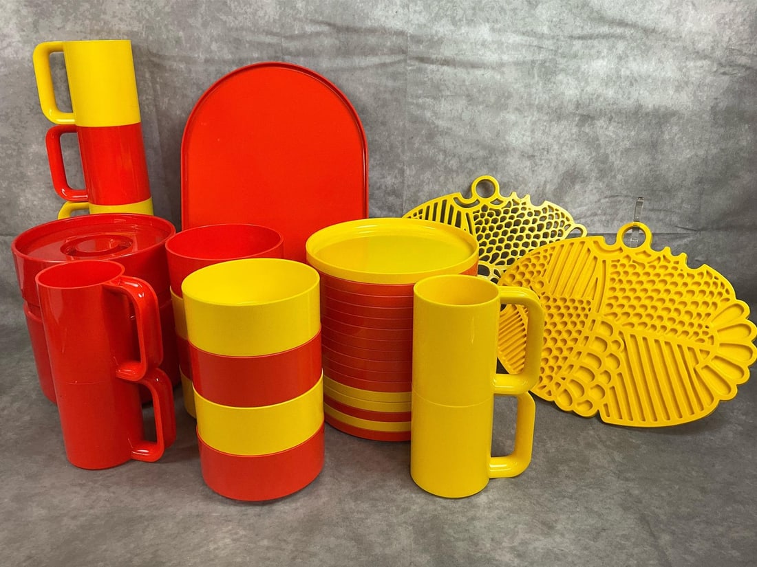 Hellerware Set: Thirty-six piece plastic dinnerware. Polystyrene plastic Hellerware by Massimo Vignelli. Vibrant yellow and orange set includes plates, cups, bowls, tray, ice bucket and trivets. All in good