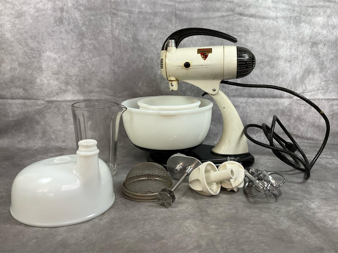 Sunbeam Mixer with Attachments: 1940's mixer. White enamel with black base Sunbeam Mixmaster electric mixer. Includes two milk glass bowls, juicer attachment made of white glass, a milkshake clear glass pitcher, and other