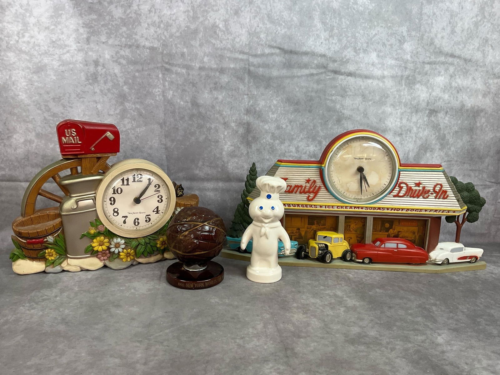 Burwood Clocks & Coin Banks: Vintage Family Drive-In clock and Country Mailbox clock made by Burwood Products 1973. Both untested, and clock numbers have faded and clock face is broken on Drive-In clock. Ceramic coin banks from
