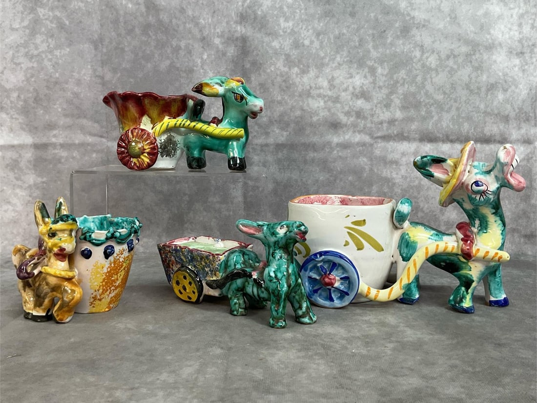 Italian Pottery Donkey & Carts: Four mid century planters. Vibrant glazed Italian pottery. "Donkey pulling a cart" fun planters. Largest has a tiny chip on his nose and smallest has a chipped ear. Otherwise in good condition.