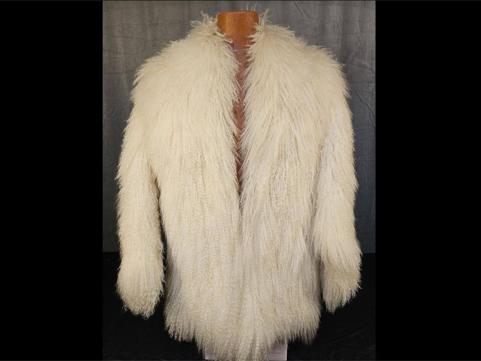 Lamb Fur Coat: Vintage white Mongolian/Tibetan Lamb's fur coat. Two external pockets and one hook and loop closure. Good condition. No label or size.