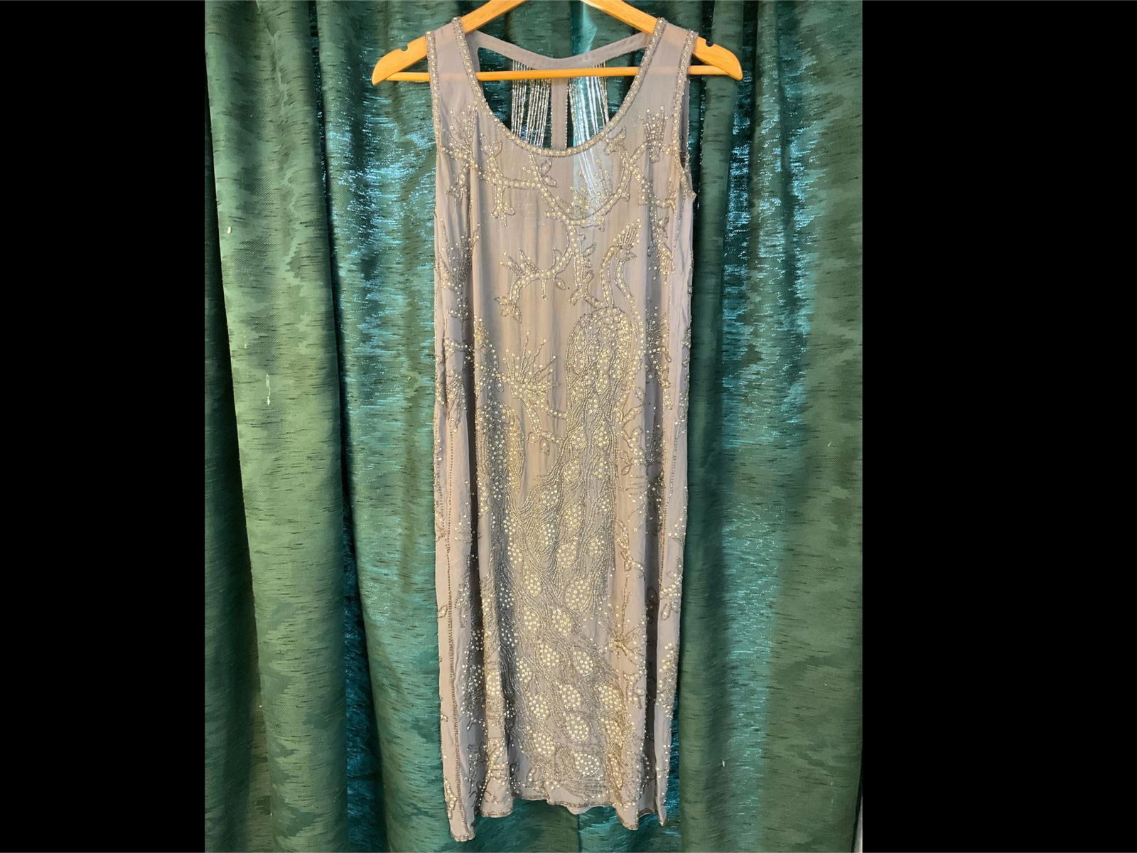1920's Couture: Circa 1925 beige/grey silk flapper style dress with rhinestone and glass bead floral - branch design and open beaded back. Some staining around neckline. Signs of wear commensurate with age and use.