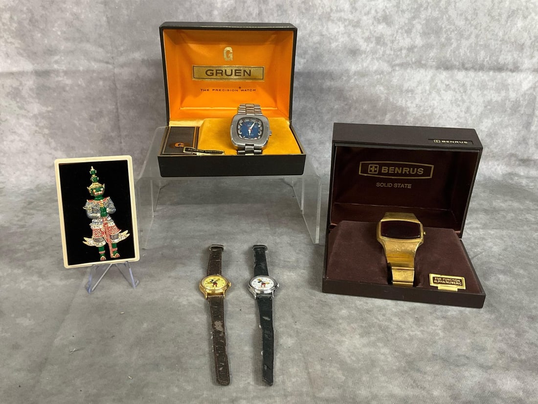 Vintage Watches & Brooch: Four mid century watches and brooch. Gruen men's watch with Precision Autowind Calendar in working condition. Benrus gold tone men's watch Solid State 5 function is untested. Two ladies Lorus Mickey