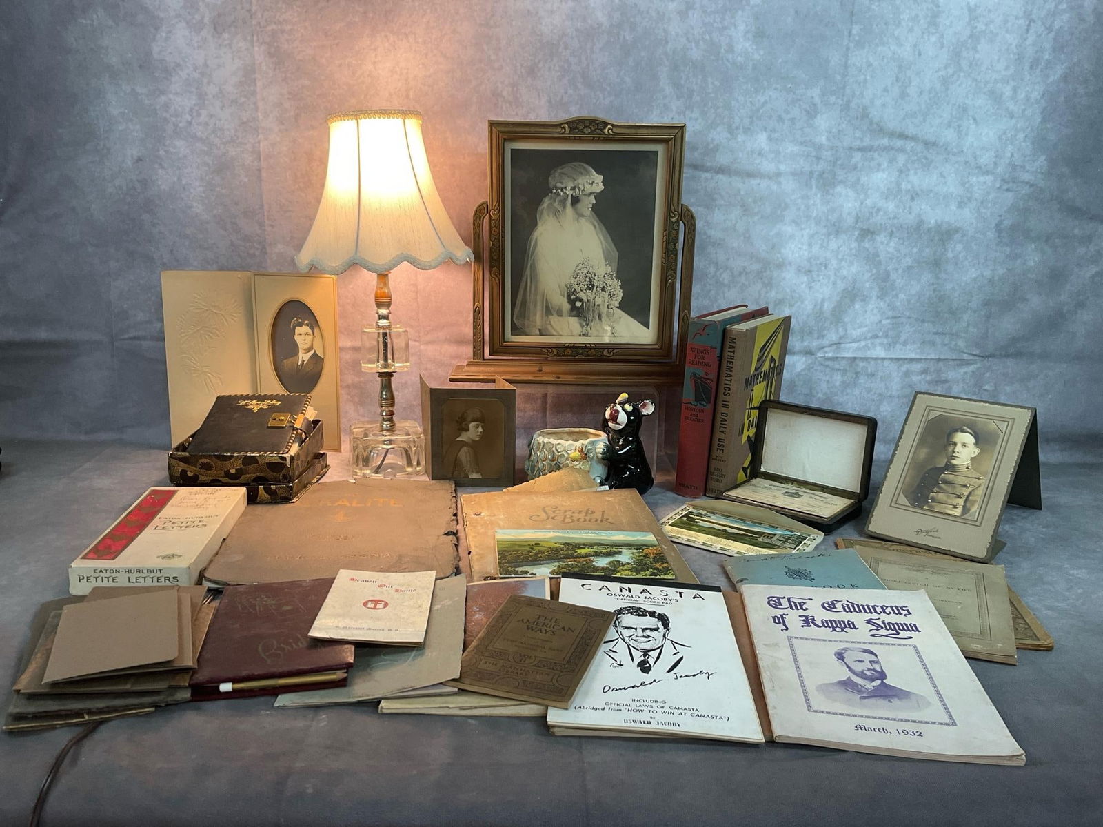 Pictures, Books, A Lamp, & More from Ingles Castle: Lot of items from late 1800s to early 1900s. Includes a framed wedding picture, and ten photos of Ingles Family members. Included is a glass based lamp, bear and bees planter, and 1940's school