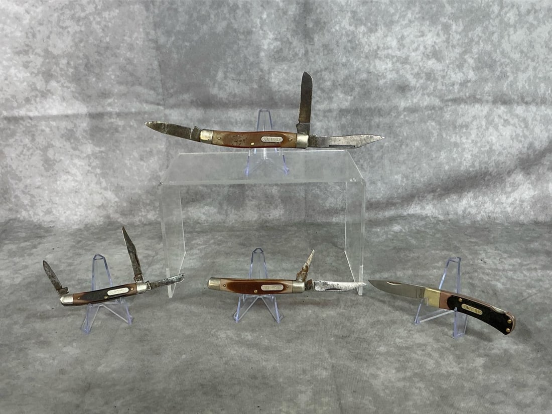 Old Timer Knives: Lot of four mid-twentieth vintage collectible "Old Timer" folding knives. One three blade Schrader Old Timer marked "U.S.A. 30T". Discoloration and very minor pitting to blade. One Schrader Old Timer