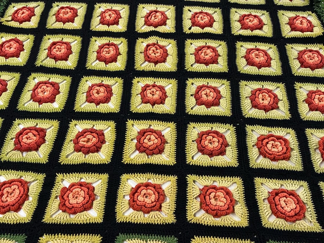 Granny Squares Throw: 1970's afghan. 3D rose pattern granny squares throw. In good condition. Measures 45 inches wide x 64 inches long.