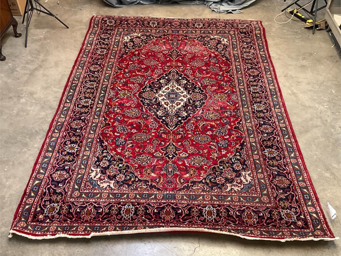 Persian Carpet: Vintage late 20th century Persian/Iranian Tabriz carpet made in Iran. Several areas of visible wear, otherwise good condition. Measures 78 inches width x 116 inches length.