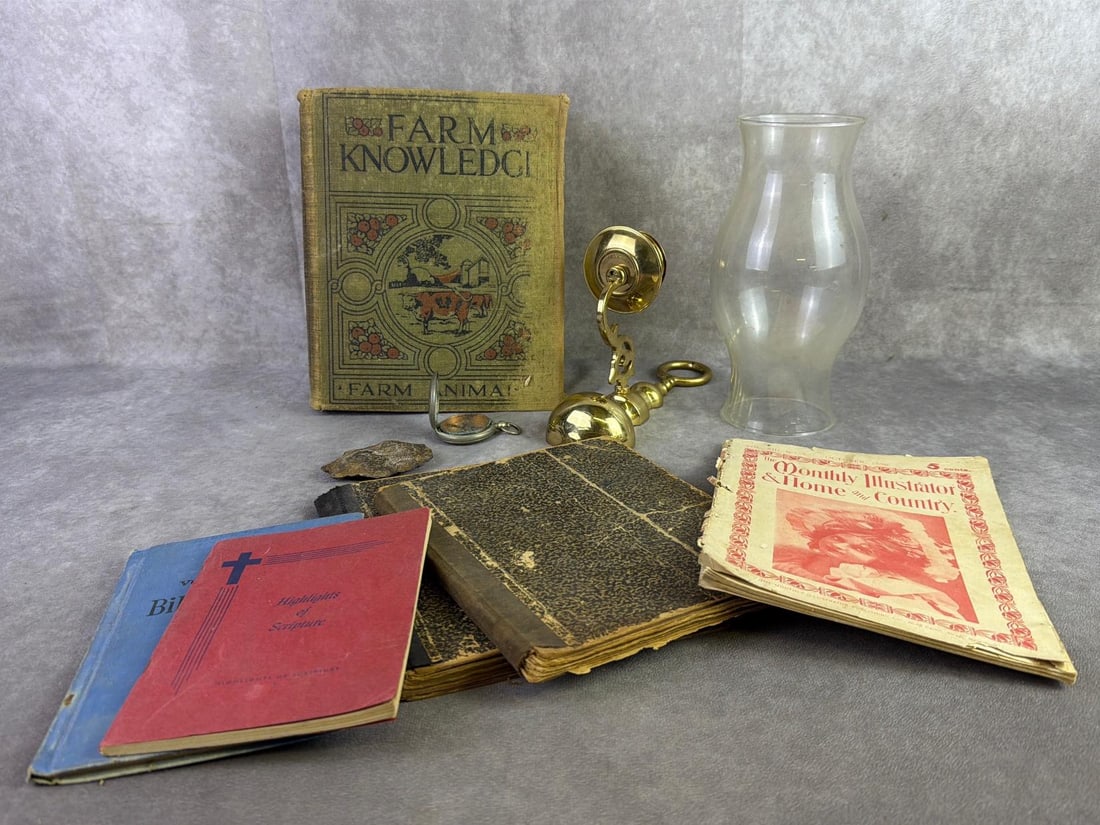 Brass, Books & More: Brass candle sconce, hurricane shade, pocket compass, and books. All in fair to good condition. Farm Knowledge measures 7.75 inches wide x 9.75 inches tall.
