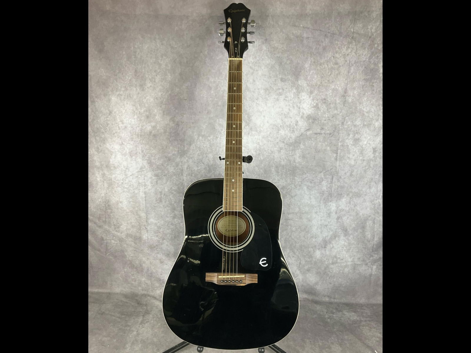 Gibson Epiphone DR-100 EB Acoustic Guitar: Gibson Epiphone DR- 100 classic dreadnought body black finish six string acoustic guitar. Die cast tuners, black single ply pick guard, spruce top and mahogany for back, sides, and neck, rosewood fret