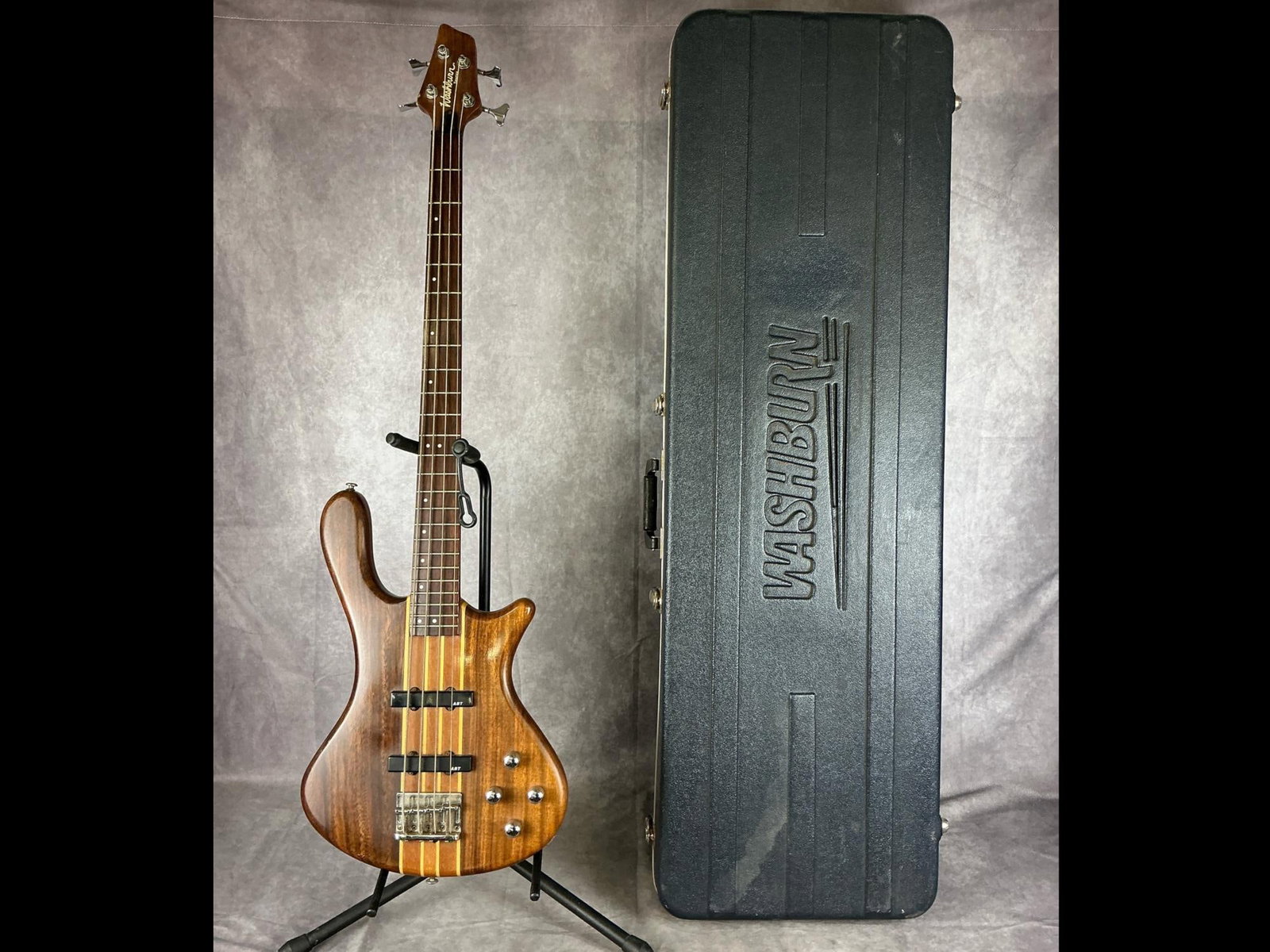 Washburn Taurus T-24 Electric Bass: Washburn Taurus t-24 Taurus bass shape body from mahogany natural matte finish four string electric bass. Four volume/tone knobs, custom jj pickups, multi laminate maple/mahogany neck. No visible