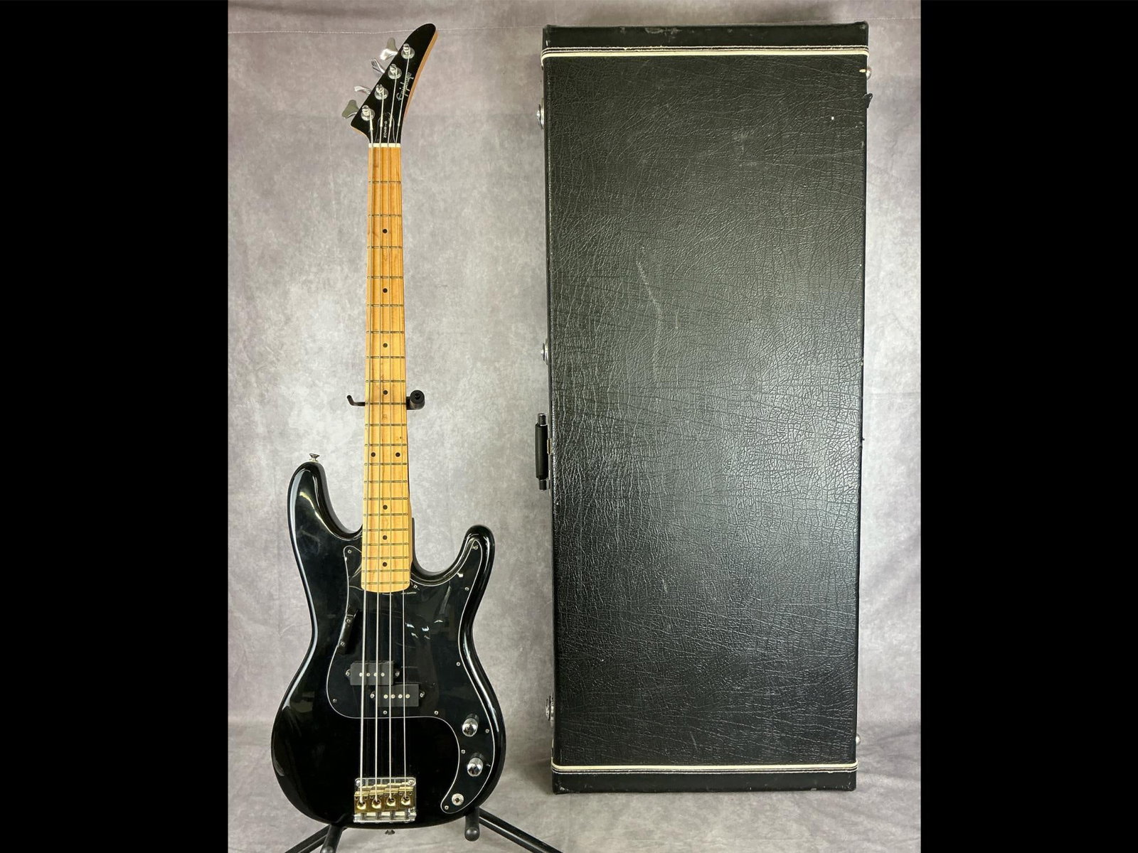 Gibson Epiphone Four String Bass: Epiphone double cutaway precision bass body from mahogany in black finish with off black pick guard four string electric bass. Two volume/tone knobs, gold finish four saddle bridge, maple fretboard. S