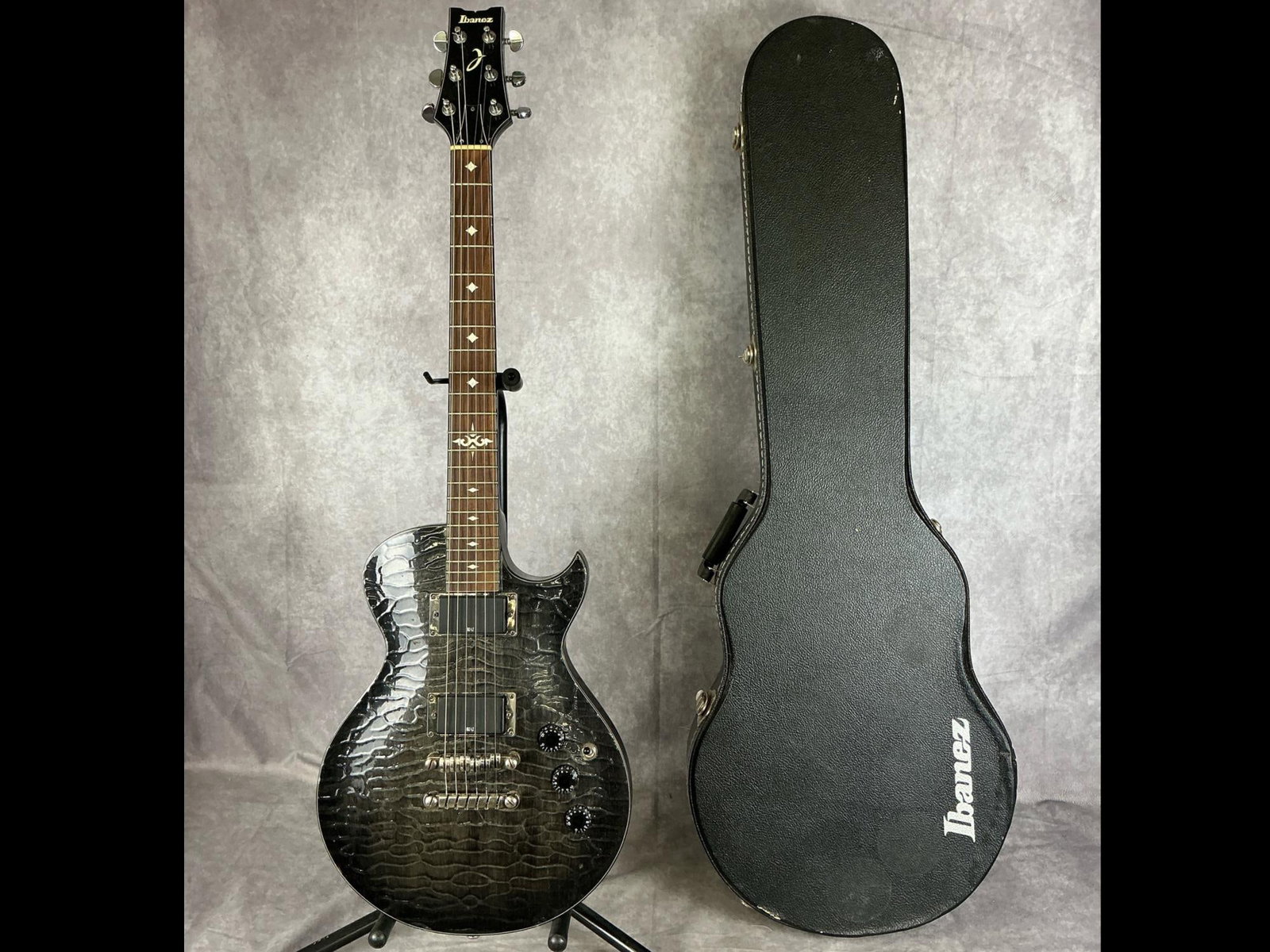 Custom Ibanez Art 300 Electric Guitar: Ibanez art 300 solid Les Paul body design from mahogany and maple top with caiman skin finish six string electric guitar. Chrome Grover machine tuners, three volume/tone knobs, three way selector swit