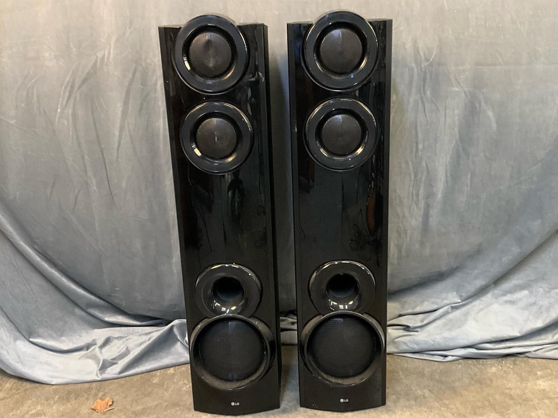LG Surround Sound: Pair of 2019 LG S65T3-S Surround Sound Speaker System. 911CSSF023654. Scratches to exterior, dent to top speaker grill, and cracked particle board to back speaker. Not tested. Measures 9 inches wide x