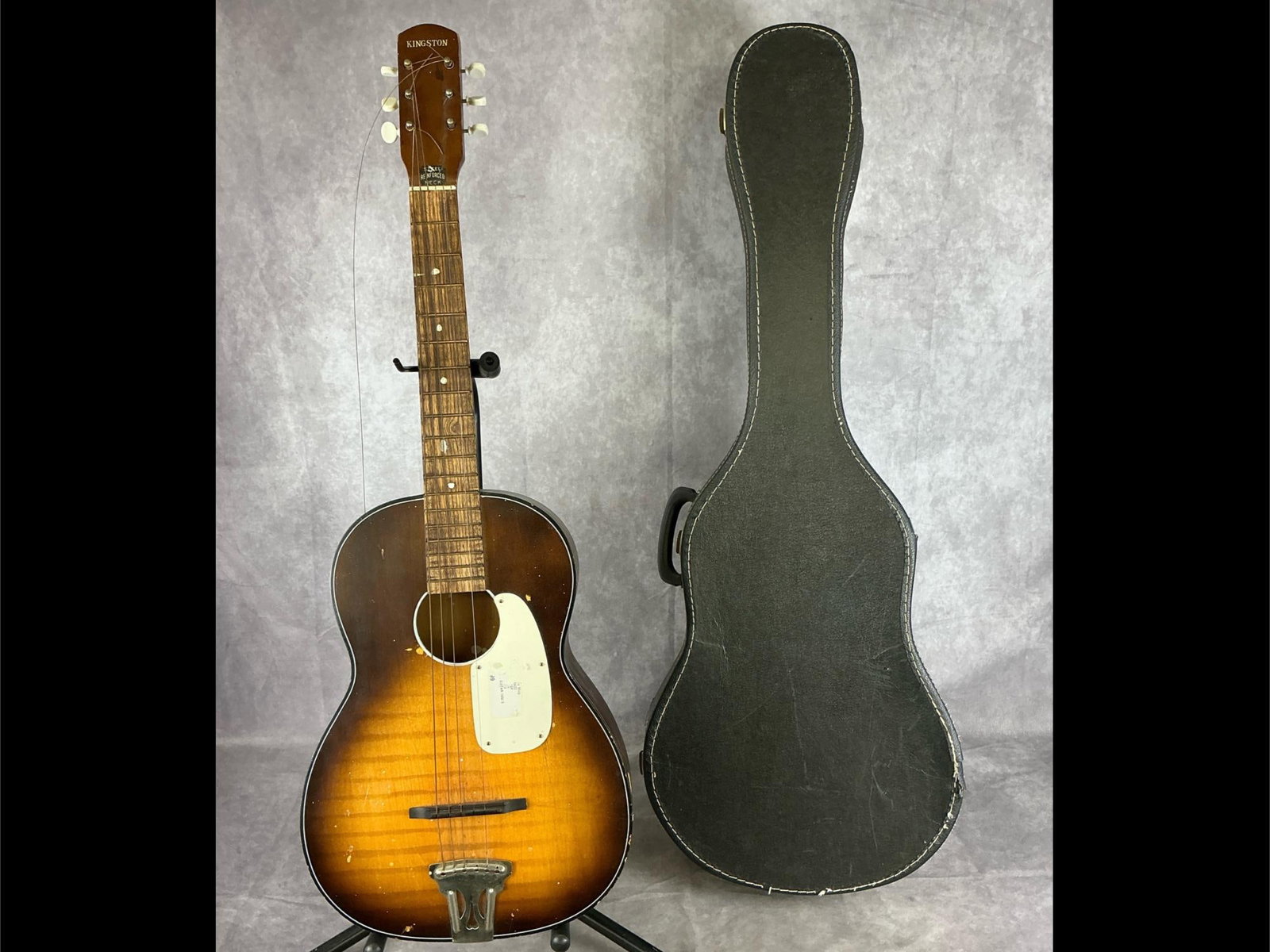 Vintage Kingston Acoustic Guitar: Vintage Kingston parlor body from birch in sunburst finish with white pick guard six string acoustic guitar. Steel reinforced neck. No visible serial number found, made in Japan. Bridge in good condit