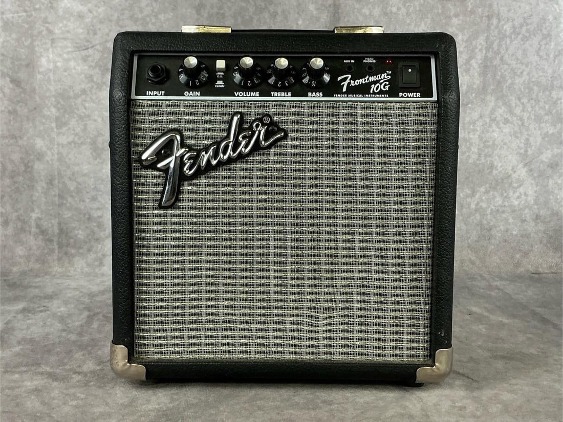 Fender Frontman 10G Amp: Model frontman 10G. Serial number ICTD15002283. One 1/4 inch input, one 3.5 mm input, gain and volume knobs, treble and bass equalizer, headphone jack. Good used condition. Measures 10 inches wide x