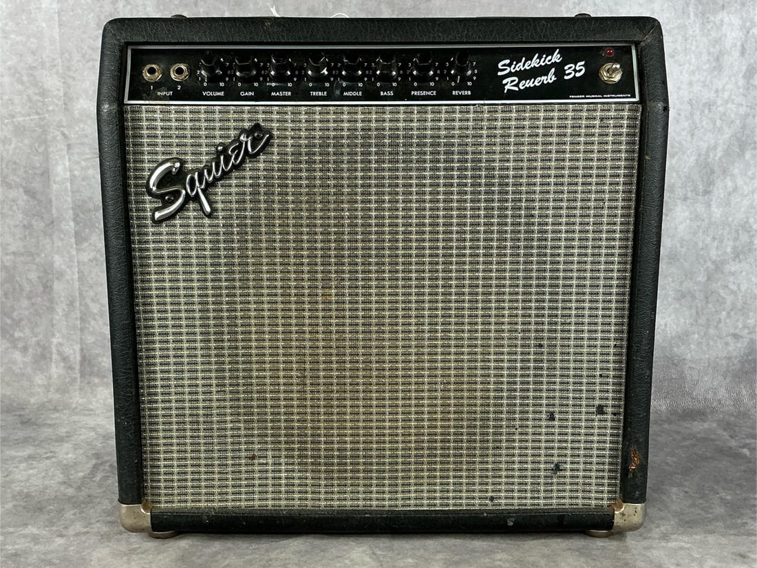 Fender Squier Sidekick Reverb 35 Amp: Model sidekick reverb 35. Serial number 105690. Two inputs, volume, gain, and master knobs, treble, mids, and bass equalizer, presence and reverb knob. Good used condition with wear and tear. Tested,