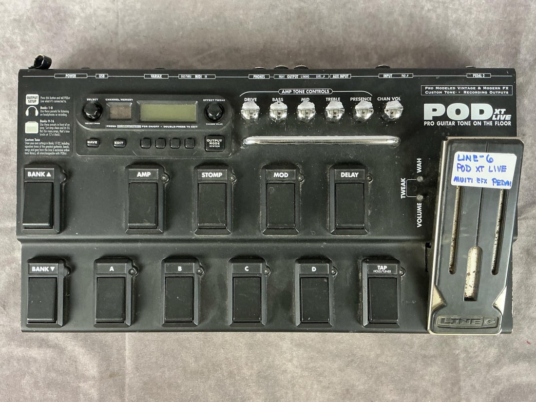 Line-6 PODXT Live Multi Effect Pedal: Model POD live xt. Serial number 6 14252 03781 5. 12 pedals, six knobs, digital interface. Good used condition. Untested. Measures 20.5 inches wide x 11 x 4 inches tall with tallest pedal.