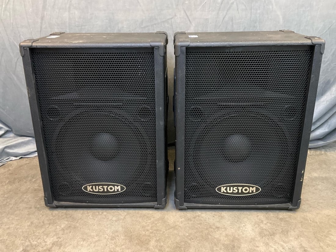 Kustom Speakers: Pair of Kustom KPC 15 Studio Speakers. Serial Number J13430108. Scratches to speaker exterior, not tested, otherwise visibly good condition. Measures 19 inches wide x 14.5 x 26 inches tall.