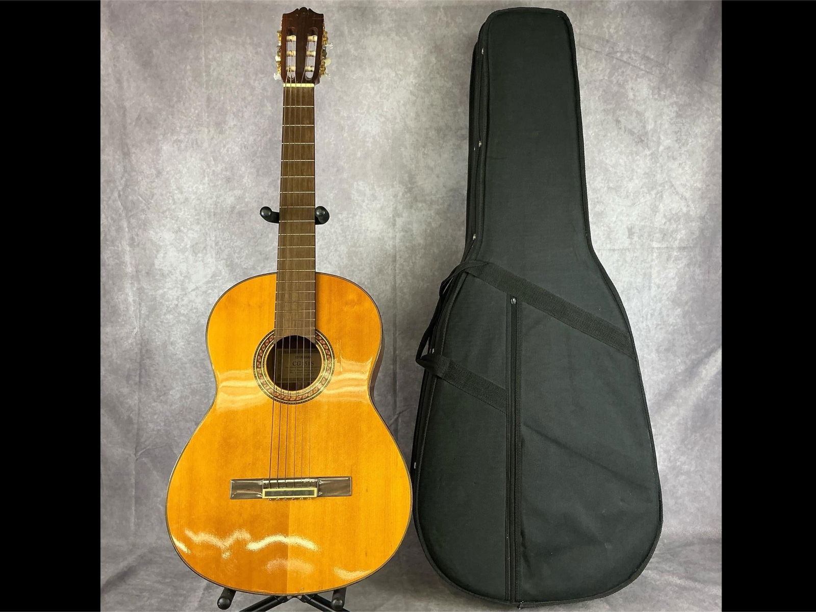 Yamaha CG151S Acoustic Guitar: Yamaha cg151s classical body from rosewood and spruce top in natural gloss finish six string acoustic guitar. Slotted headstock, wide fretboard. Serial number QPI270587. Bridge, strings, tuners, and