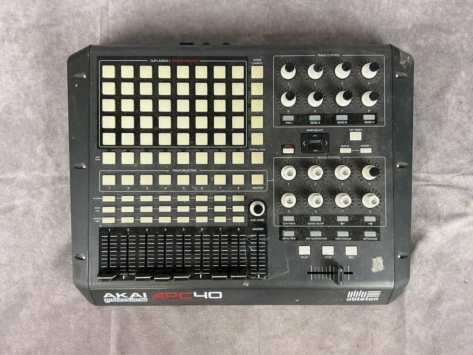 Akai Pro APC 40 Controller: Model apc 40. Serial number K21305023800955. 8 level faders, 8 track controllers, 8 device controllers. Used condition. Tested, powers on. Measures 17 inches wide x 13 x 1.5 inches tall.