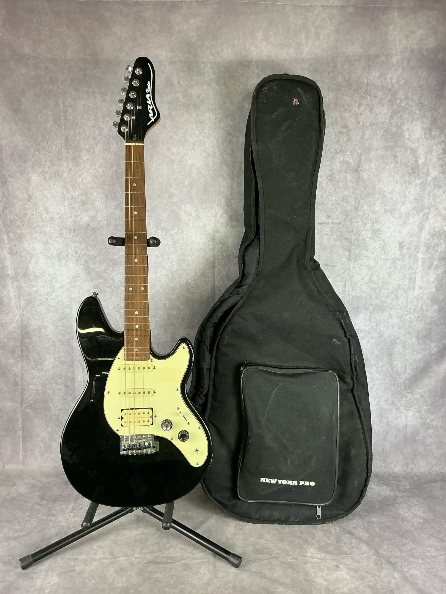 Aria Nester Stratocaster Electric Guitar: Aria nester Stratocaster body from mahogany in black gloss finish with off white pick guard six string electric guitar. Two volume/tone knobs, five way selector switch, hss pickup configuration. No vi
