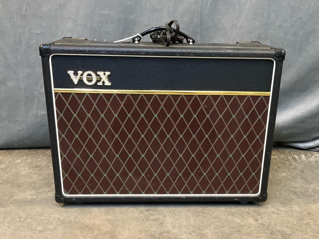 Vox Amplifier: Vox AC15SC1 Amplifier. Serial No. J12 - 016805. Powers on, not tested. Missing “Normal “ and “Top Boost” plugs. Measures 23.5 x 10.25 x 17.25 inches tall.
