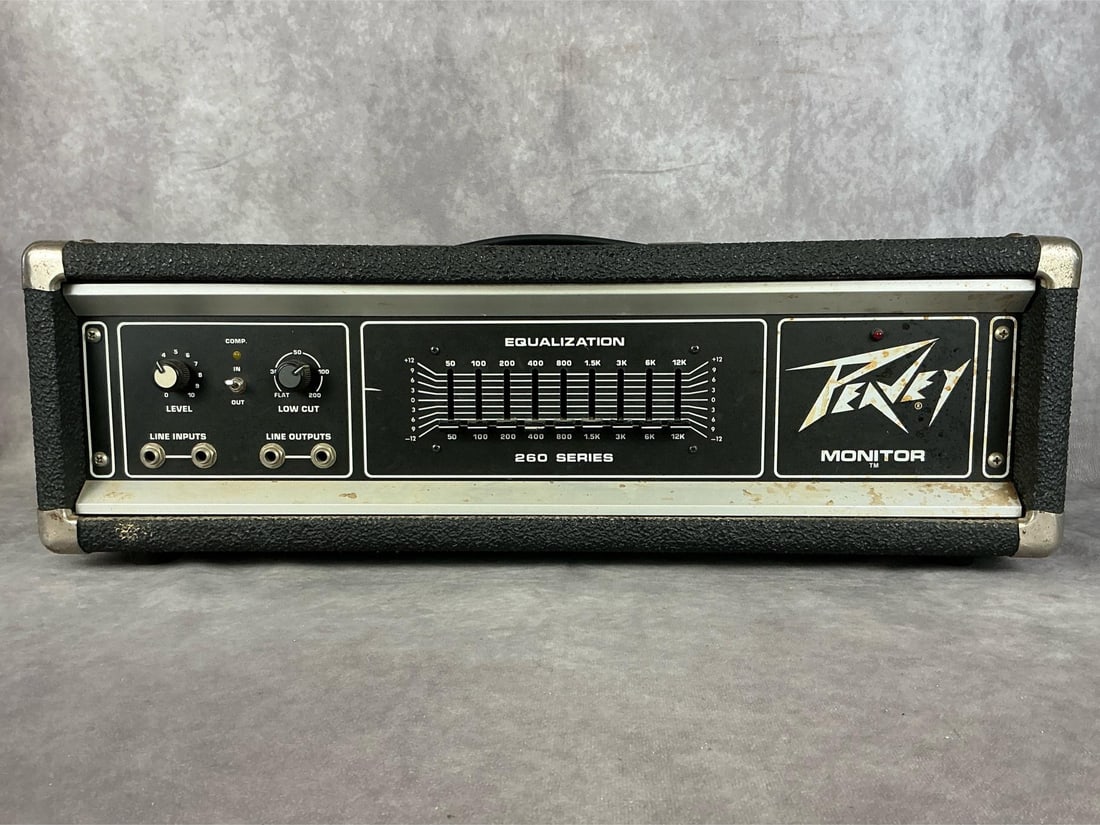 Peavey 260 Series Monitor: Model monitor amp. Serial number 4A-01326236. Nine band equalizer, two inputs, two outputs, level and low cut controls. Fair used condition, untested. Measures 24 inches wide x 11 x 8 inches tall.