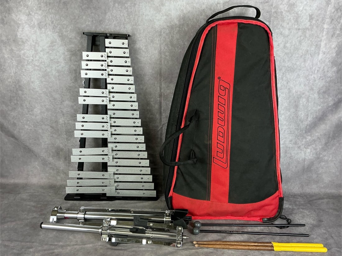 Ludwig Xylophone: Ludwig 32 key xylophone. Serial number 06033455. Comes with two sets of mallets, stand, and case. Measures 24 inches wide x 13.5 x 2 inches tall.