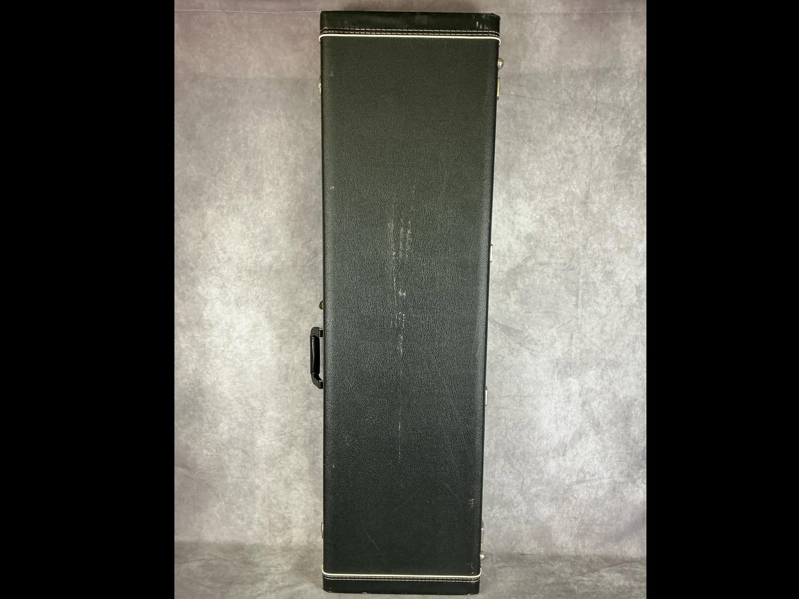 Unbranded Hardshell Bass Case: Unbranded hardshell bass case. Comes with compartment with lid, latch seal. Measures 14.5 inches wide x 48 inches long.