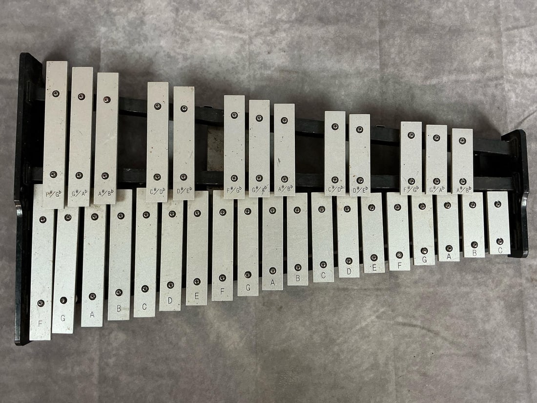 Unbranded Xylophone: Unbranded 32 key xylophone. No model or serial number found. No case or mallets included. Measures 24 inches wide x 13.5 x 2 inches tall.