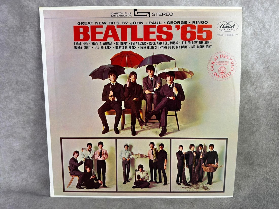 Beatles Album: 1965 Beatles vinyl titled Beatles 65. In good condition and in original sleeve. Measures 12.25 inches wide x 12.25 inches tall.