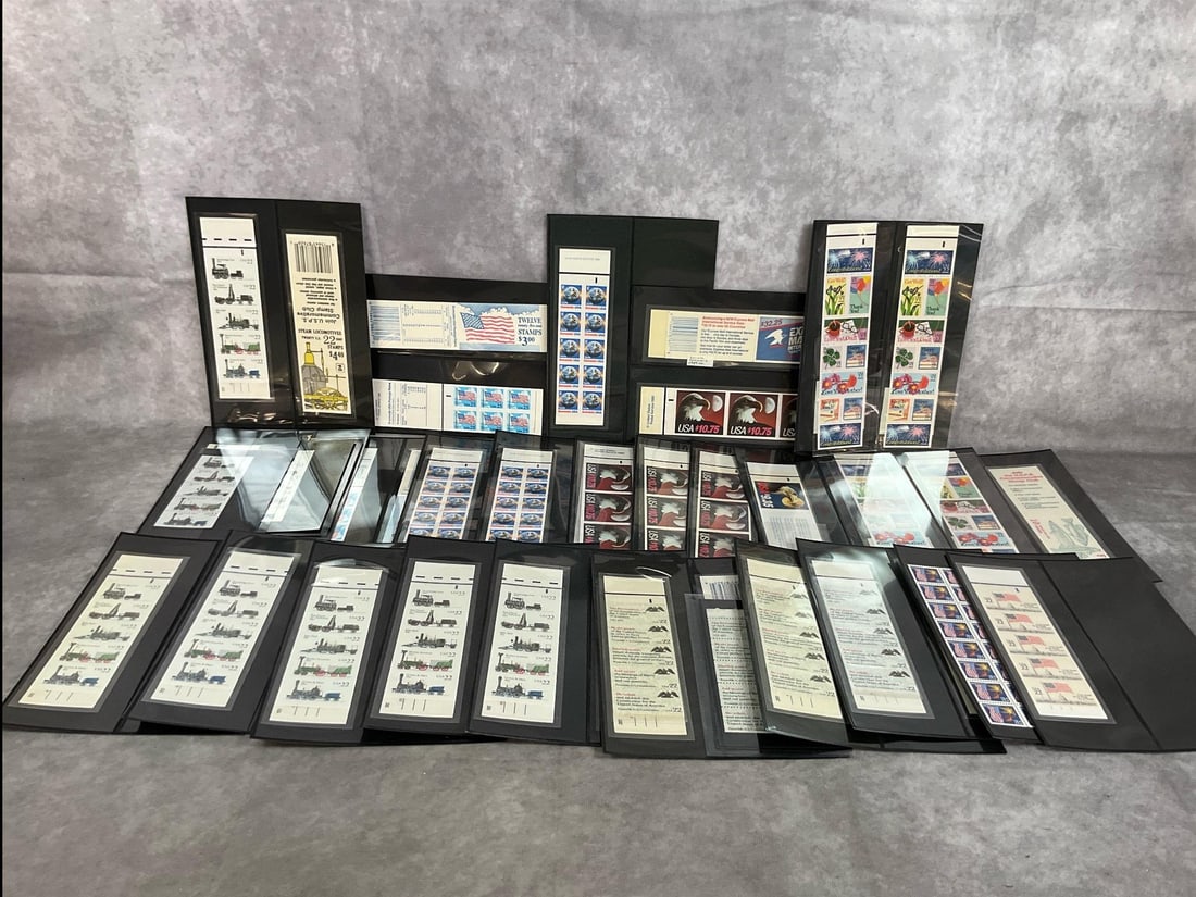 Postage Stamp Collection: Over 40 books of collectible postage stamps of various denominations, each book having 10 to 20 each. Includes fishing, USA, trains, and more. All uncirculated and in protective sleeves. Contents to