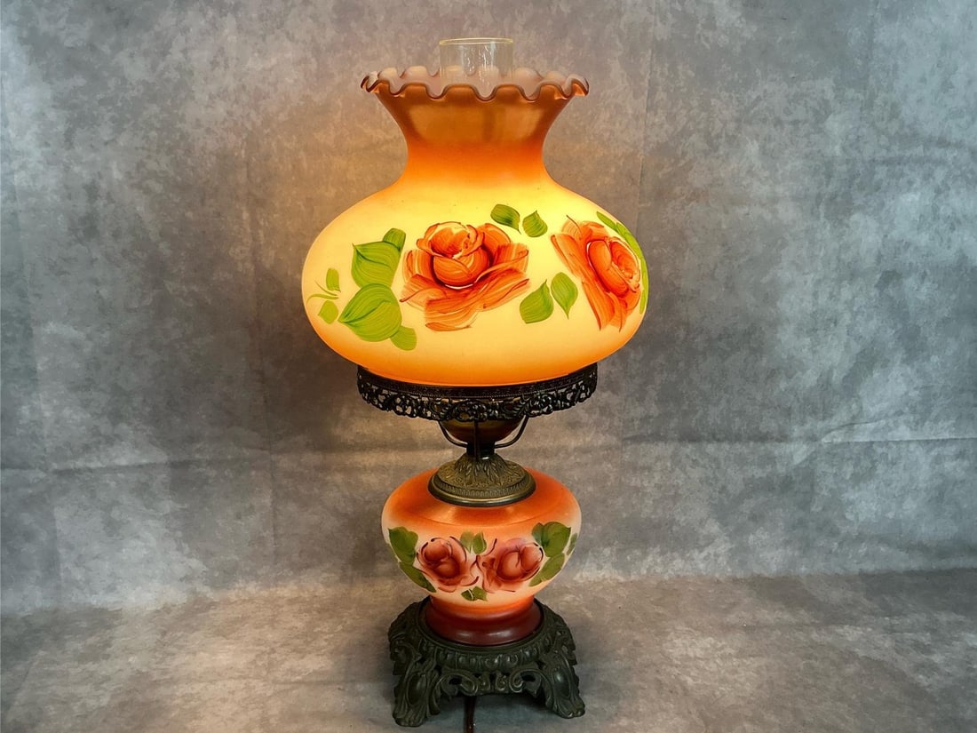 Rose Parlor Lamp: Mid century lamp. Gone with the Wind hurricane parlor lamp with 3 way lighting. Tinted roses on globes with metal. Works well and in good condition. Measures 10 inches across top globe x 19 inches tal