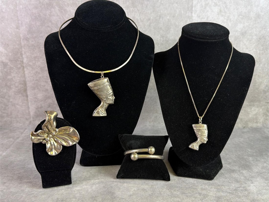 Sterling Silver Jewelry: Lot of sterling silver jewelry including 2 Egyptian necklaces, a hinge bangle, and a butterfly brooch. All in good condition, stamped with oxidation present. Total weight 2.87ozt.