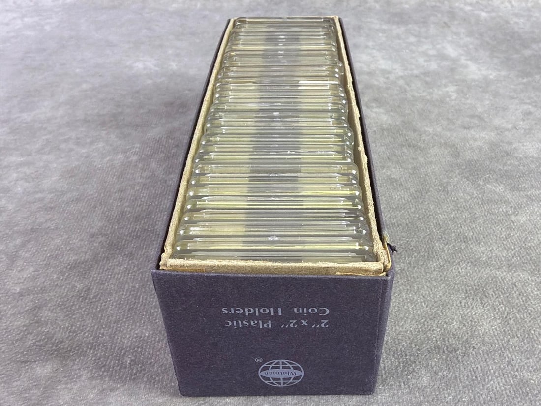 Foreign Coins: Lot of thirty one foreign coins ranging in date from 1859 to 1968 and from various countries. All in good circulated condition and in Whitman protective cases. Box measures 2.25 inches wide x 7.25 inc