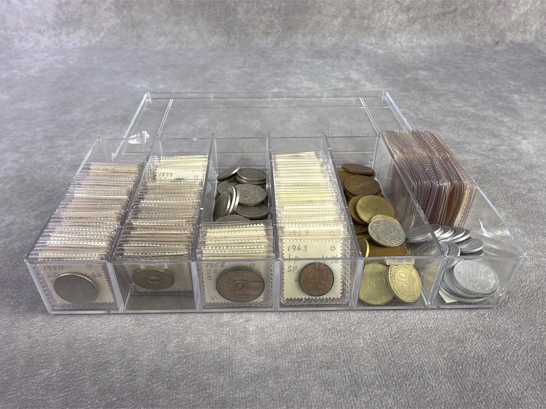Foreign Coins: Lot of foreign coins ranging in date from 1800 to 1900s and from various countries. All in good circulated condition. Box measures 8 inches wide x 4.5 inches x 1.25 inches tall.