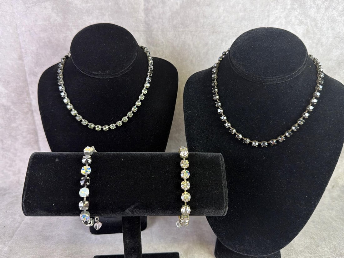 Sabika: Two Sabika necklaces and two bracelets featuring a single row of mixed cut Swarovski stones in various colors. All in good condition and handmade in Austria and Germany. Longest necklace measures 16