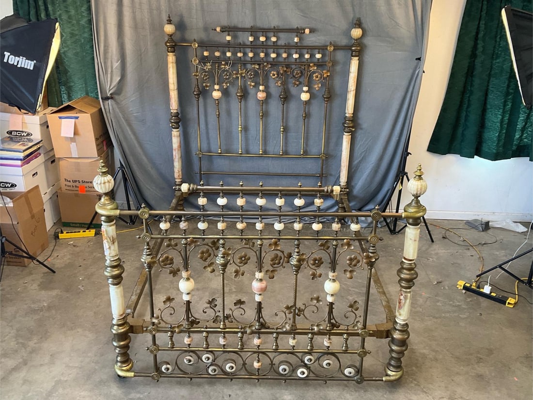 Victorian Bed: Circa 1880 Victorian brass and onyx bed with two brass side rails for holding the pillows. One brass spindle missing bolt and one missing brass finial. Good condition. Inside rail dimensions - 60