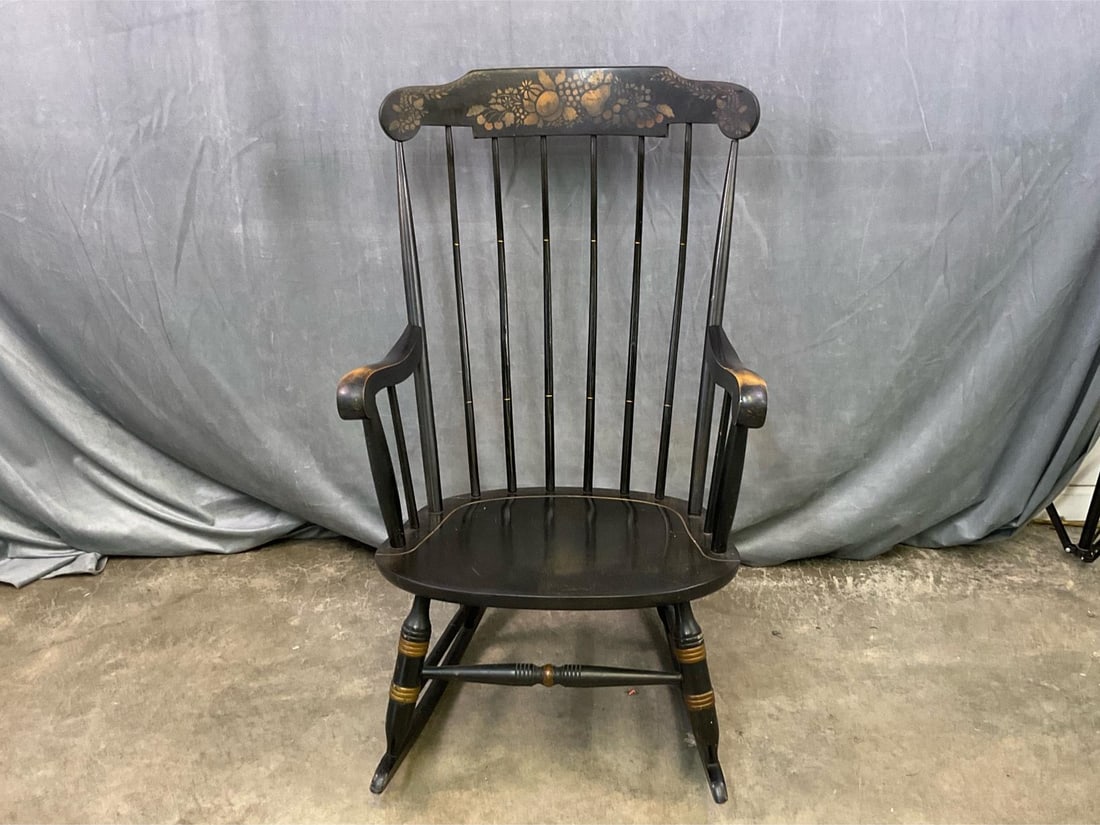 Boston Rocker: Mid - twentieth century Boston Rocker rocking chair manufactured by Nichols & Stone, Gardner, Massachusetts. Painted black and gold with hand stenciled crest rail. Good condition. Measures 22 inches