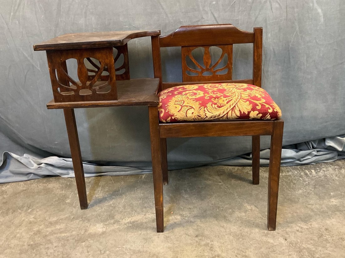 Telephone Table: Circa 1940 telephone bench/table with upholstered slip seat. Good condition with reupholstered seat. Measures 30 inches wide x 15.25 x 27 inches tall.