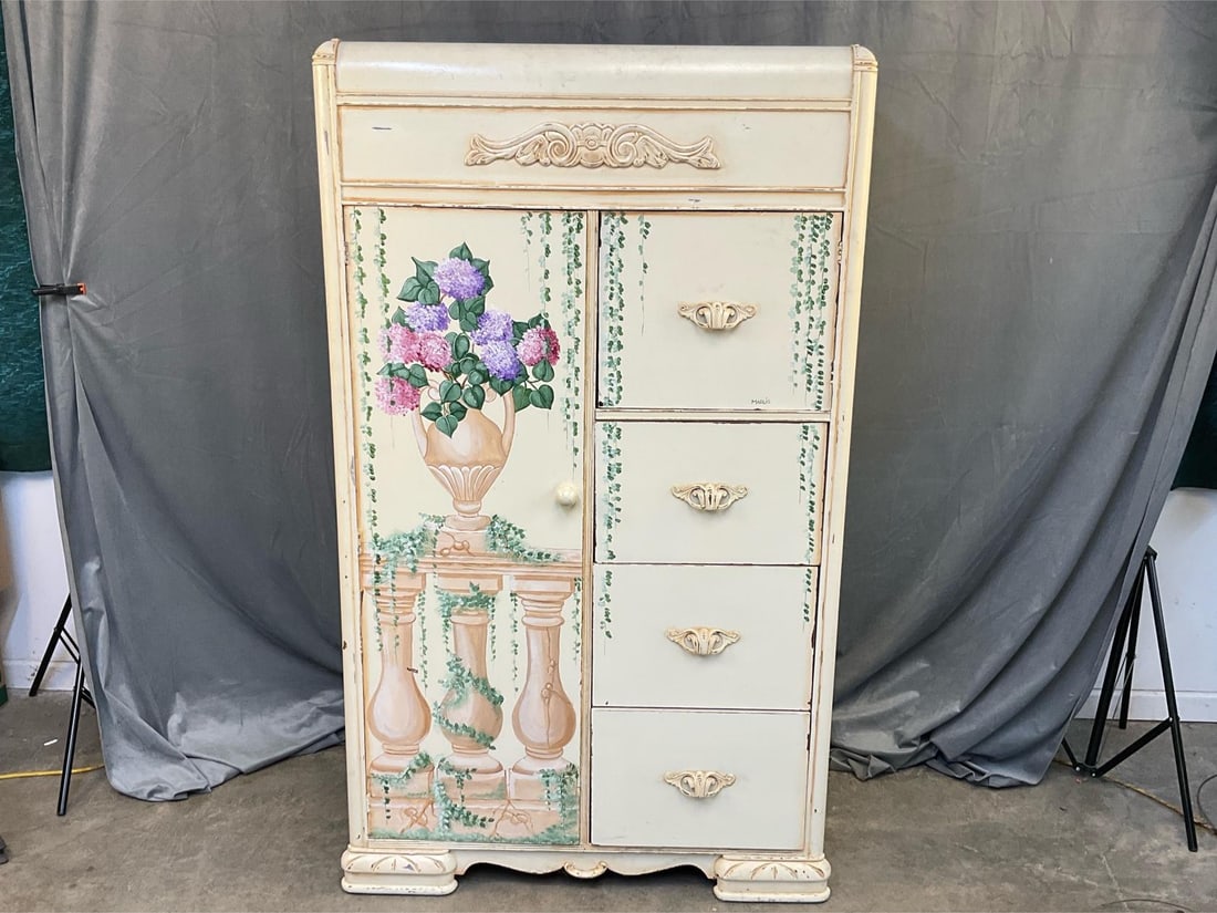 Marlis Wardrobe: Mid twentieth century decorative painted wardrobe signed “Marlis”. Some interior cedar lining with poplar. Good condition. Measures 38 inches wide x 20 x 64.75 inches tall.