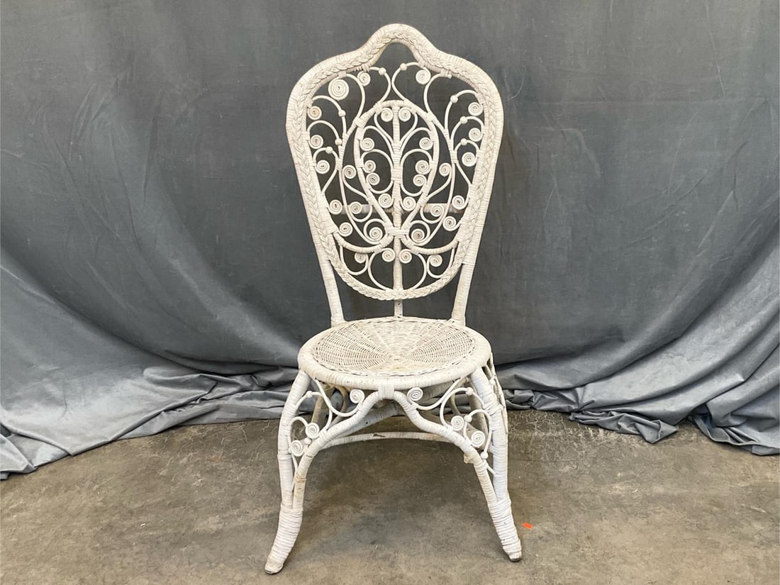 Wicker Chair: Late 20th century wicker chair. Good condition. Measures x 20.5 inches wide x 19.5 x 41 inches tall.