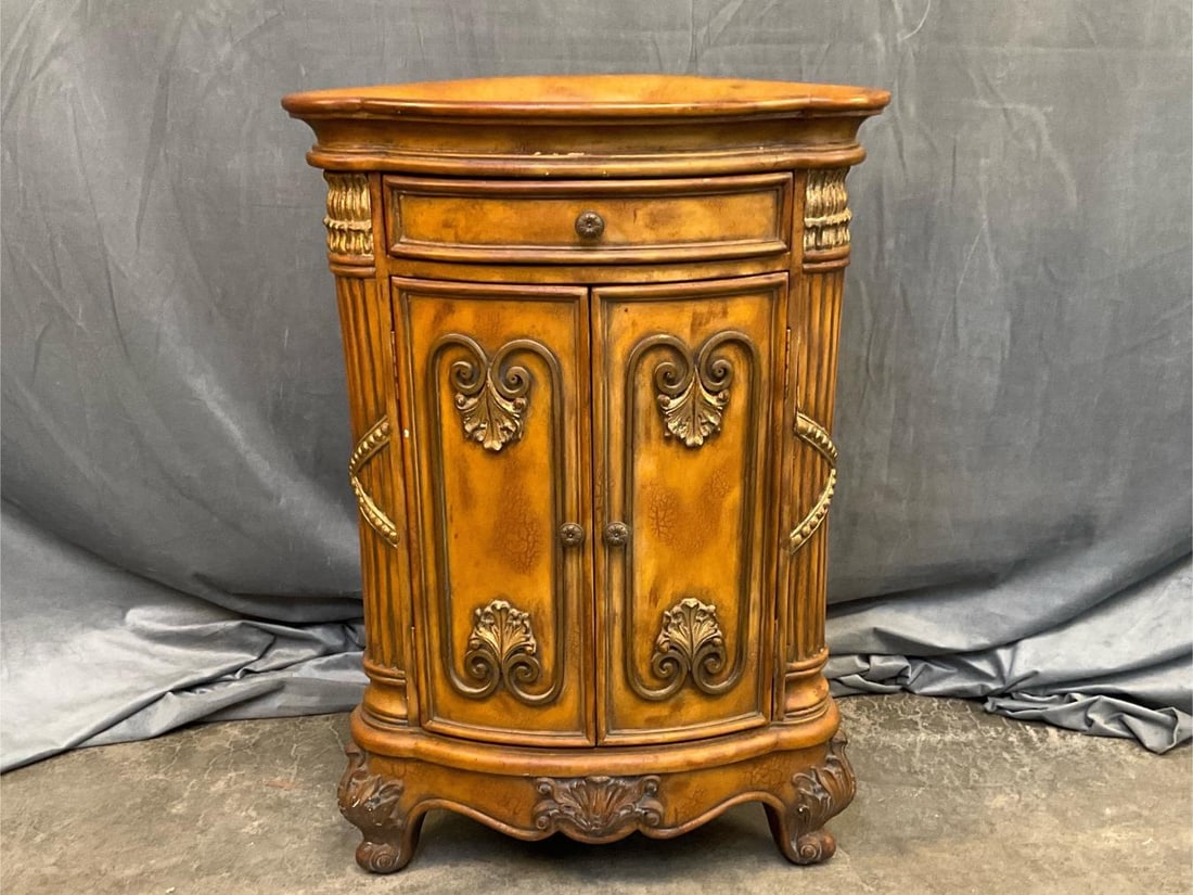 Corner Cabinet: Late twentieth century Louis XVI Style corner cabinet with one drawer. Faux gilded and applied decoration. Good condition. Measures 22 inches wide x 13.75 x 32.25 inches tall.