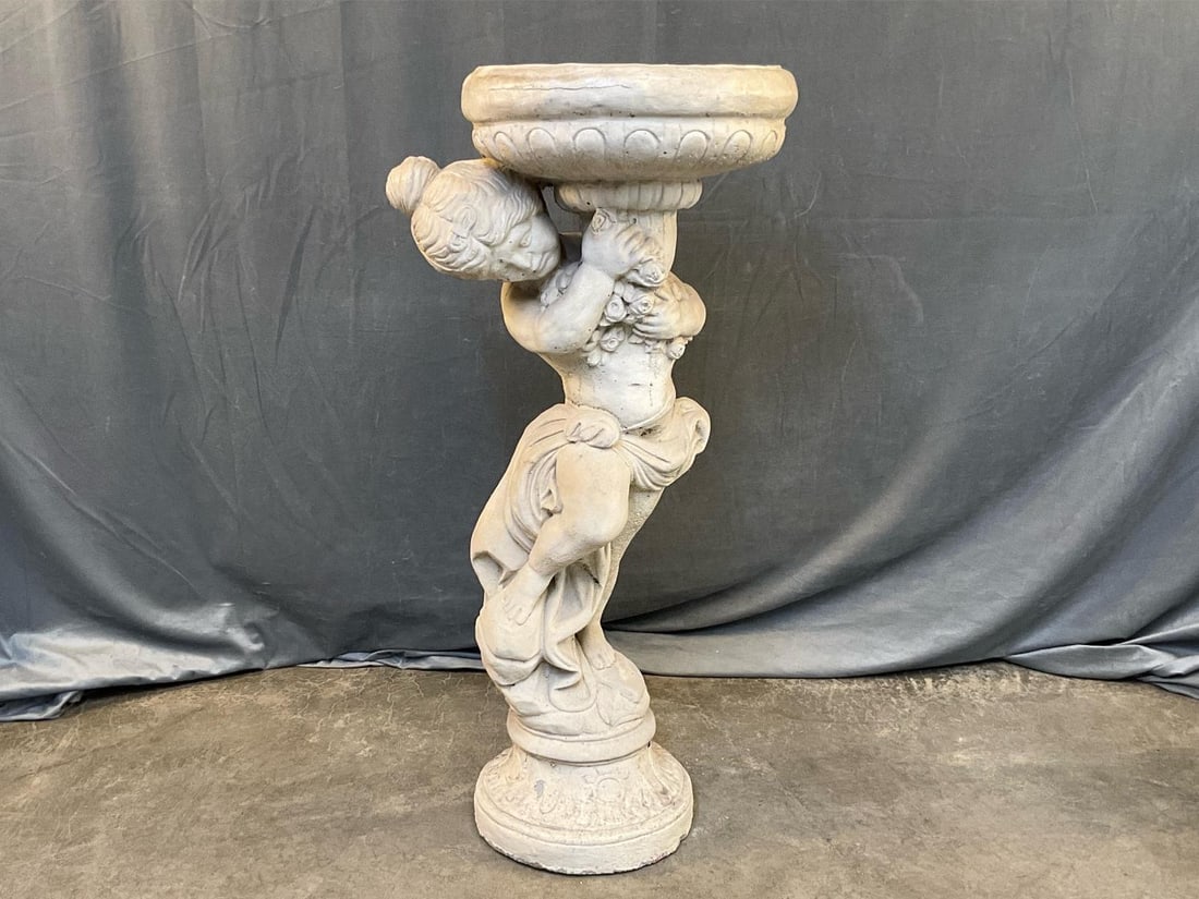 Garden Statue: Contemporary late 20th century garden statue of girl holding pot. Some small chips to base, otherwise good condition. Measures 16.5 inches in diameter x 44 inches tall.
